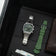 1904 Chronograph by AV86 with angular case, vintage-inspired dial, sapphire crystal, steel bracelet, and olive green rubber strap