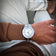 1956 Marine by AV86 vintage-inspired diver with sapphire crystal, compass bezel, and metal bracelet strap on wrist in casual setting