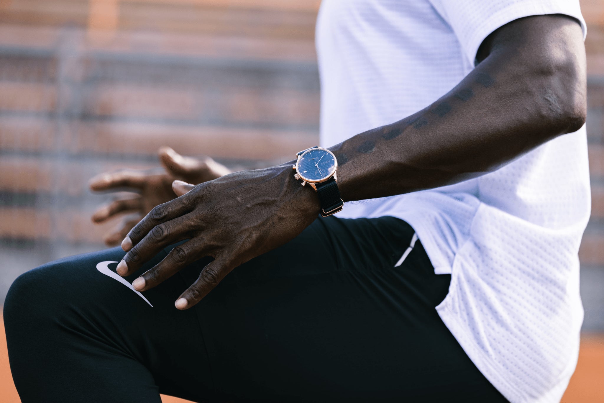 1815 Justin Gatlin, Gold / Blue Turtle by AV86 luxury chronograph with sapphire crystal and leather strap worn in athletic setting