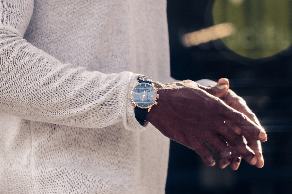 1815 Justin Gatlin, Gold / Blue Turtle by AV86 luxury chronograph with sapphire crystal and leather strap on wrist outdoors