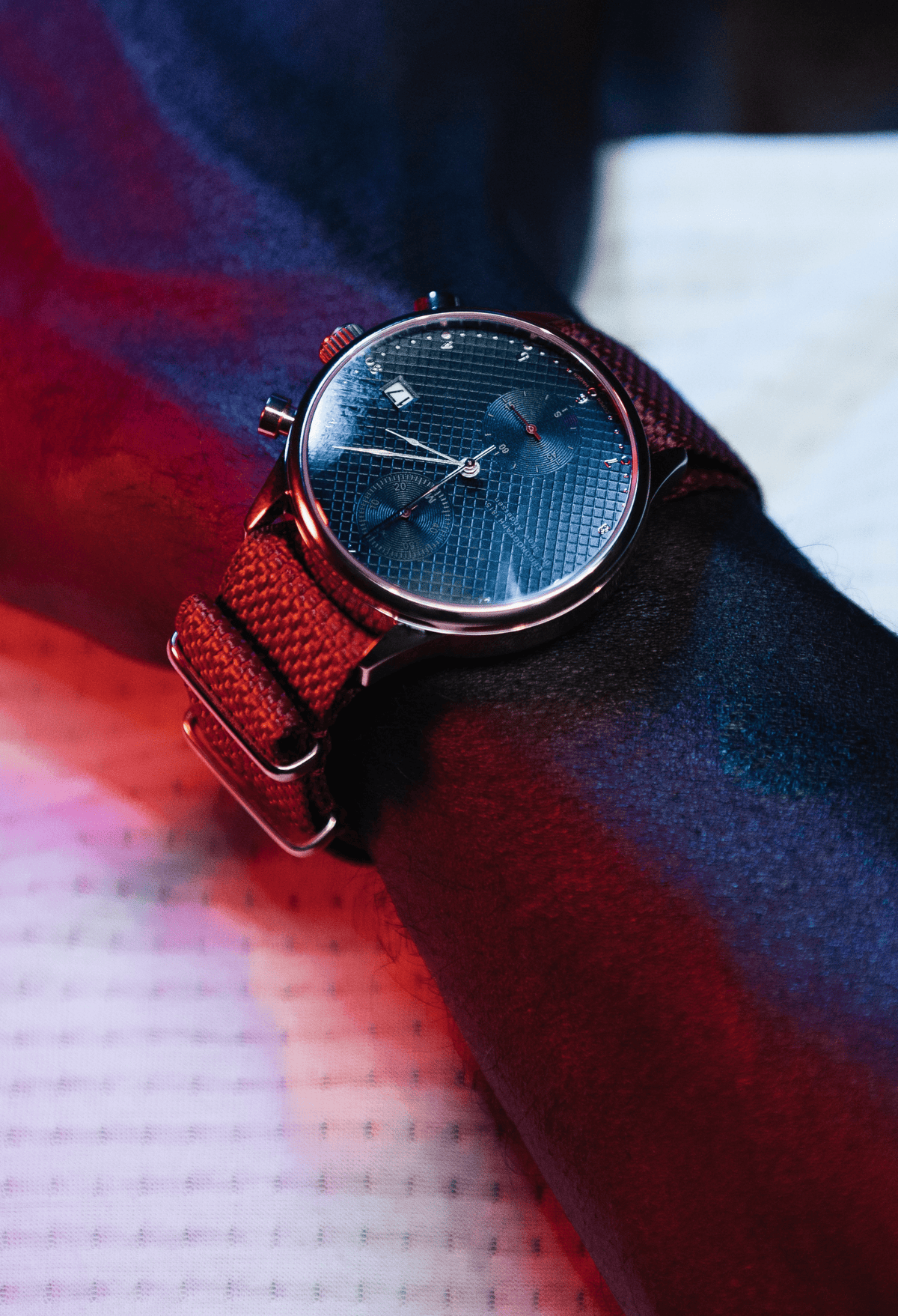 1815 Justin Gatlin by AV86 luxury chronograph with sapphire crystal, textured dial, and red woven fabric strap on wrist