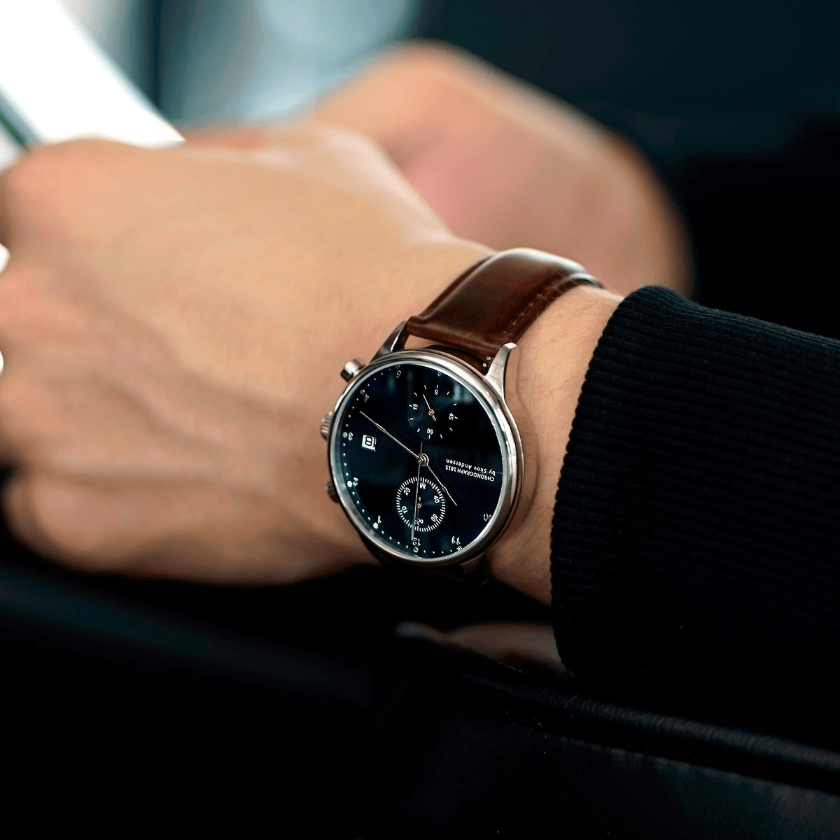 1815 Chronograph by AV86 with vintage-inspired dial, sapphire crystal, classic chronograph function, and brown leather strap on wrist