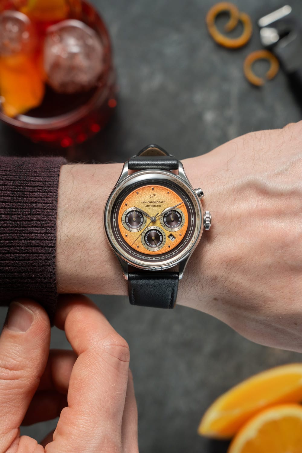1564 Chronodate Automatic by AV86 luxury chronograph with vintage-inspired dial, sapphire crystal, and black leather strap on wrist
