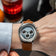 1564 Chronodate Automatic by AV86 vintage-inspired chronograph with sapphire crystal and brown leather strap on wrist