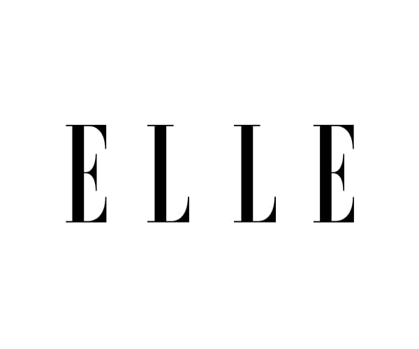 “Logo for ELLE in large black serif letters spaced widely across a light gray background.