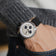 1564 Chronodate Automatic by AV86 featuring vintage-inspired chronograph dial, sapphire crystal, date window, and black rubber strap on wrist.