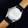 1968 Sixtyeight by AV86 with polished stainless steel case back featuring an engraved Copenhagen cityscape and leather strap